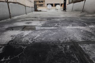 Black soot after reported black rain following a strike on fuel tanks, amid the U.S.-Israeli conflict with Iran, in Tehran.